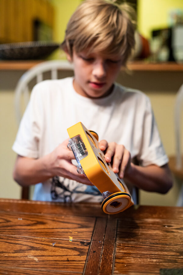 Boy Building Wheels and Motors Image